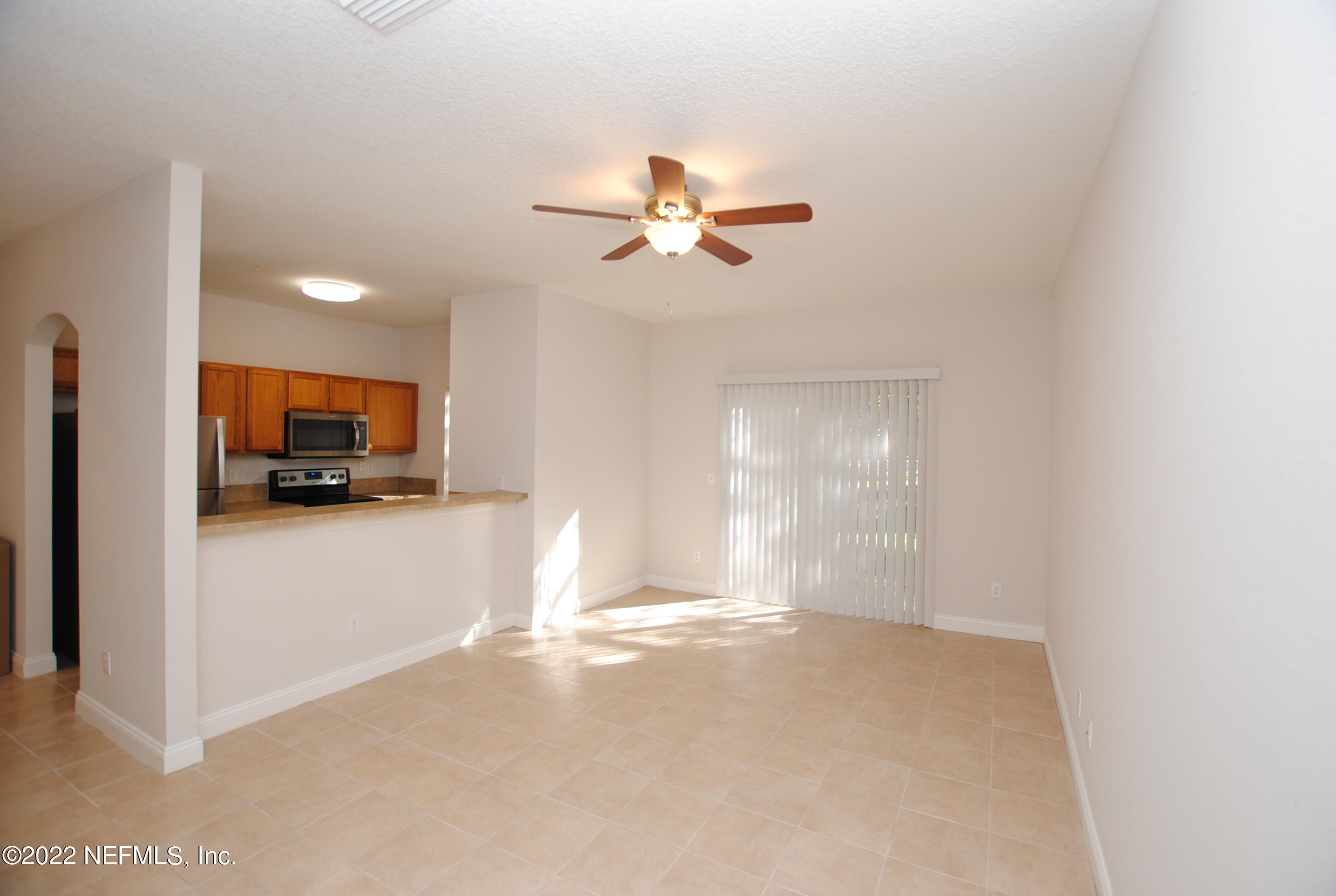 5260 Collins Road, Unit 505 Jacksonville, FL 32244 - Photo 6 of 20 a view of a livingroom with a flat screen tv