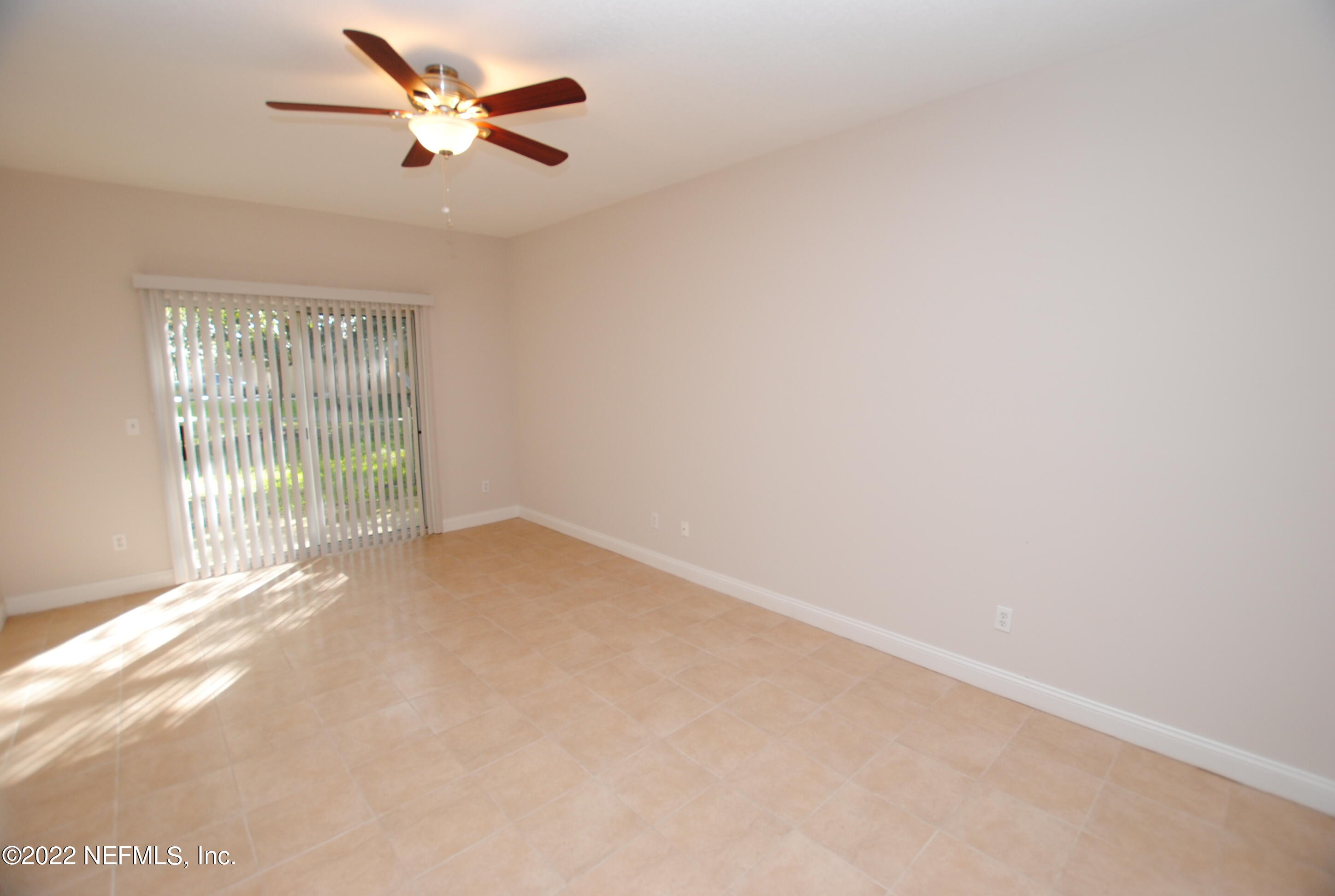5260 Collins Road, Unit 505 Jacksonville, FL 32244 - Photo 7 of 20 a view of an empty room with a window