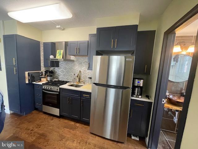2101 Chestnut Street, Unit 504 Philadelphia, PA 19103 - Photo 12 of 28 a kitchen with stainless steel appliances granite countertop a refrigerator a stove and a sink