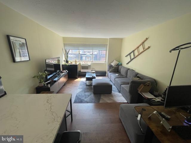 2101 Chestnut Street, Unit 504 Philadelphia, PA 19103 - Photo 13 of 28 a living room with furniture and a flat screen tv