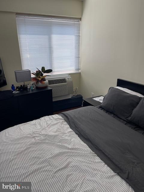 2101 Chestnut Street, Unit 504 Philadelphia, PA 19103 - Photo 22 of 28 a bedroom with a bed and a window