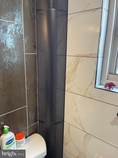 2101 Chestnut Street, Unit 504 Philadelphia, PA 19103 - Photo 10 of 28 a bathroom with a toilet and a shower