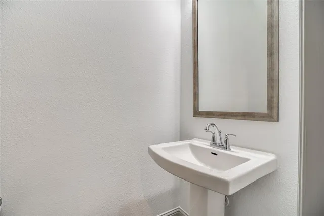 a white sink sitting next to a white sink