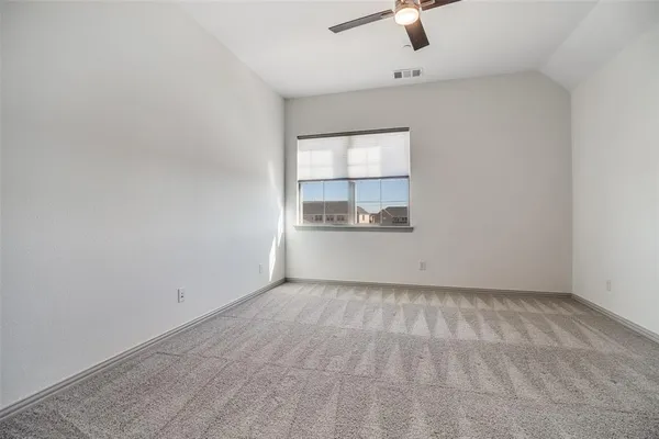 an empty room with a empty space and windows