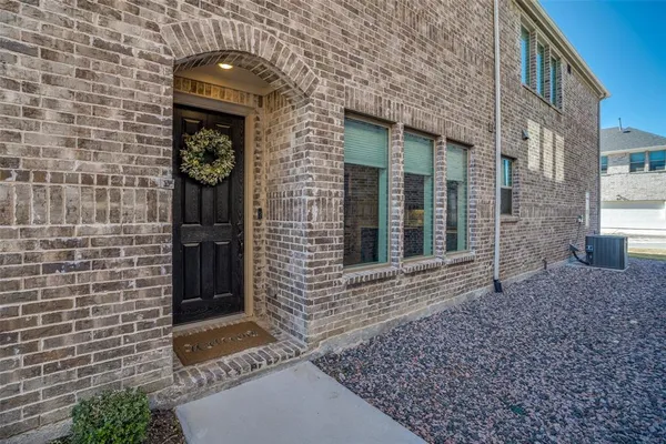 a brick building with a door and a window