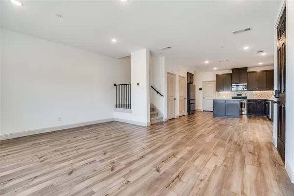 a view of kitchen and wooden floor