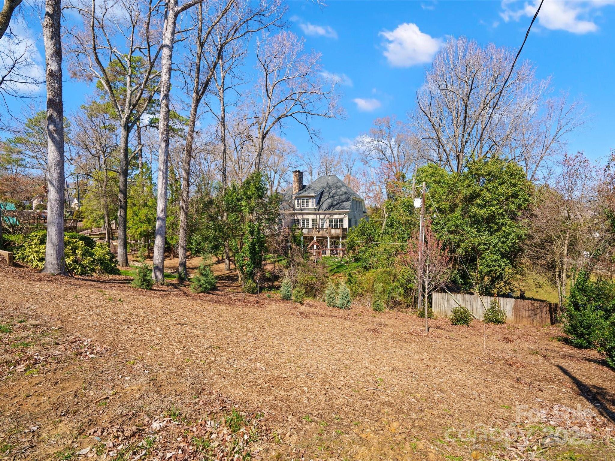 1539 Lilac Road Charlotte, NC 28209 - Photo 4 of 16 a view of a street with a tree