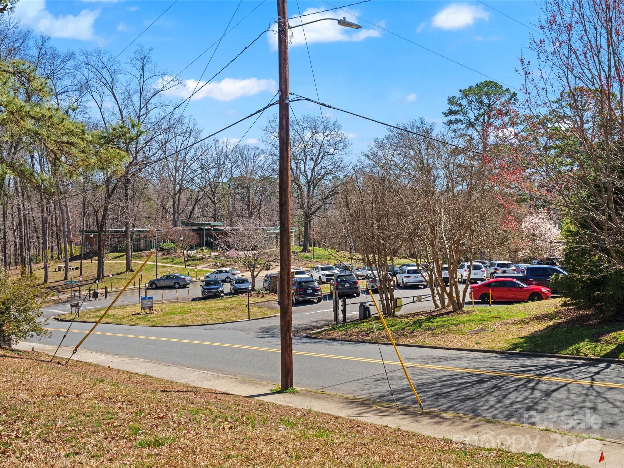 1539 Lilac Road Charlotte, NC 28209 - Photo 9 of 16 a view of a swimming pool with a bench and trees
