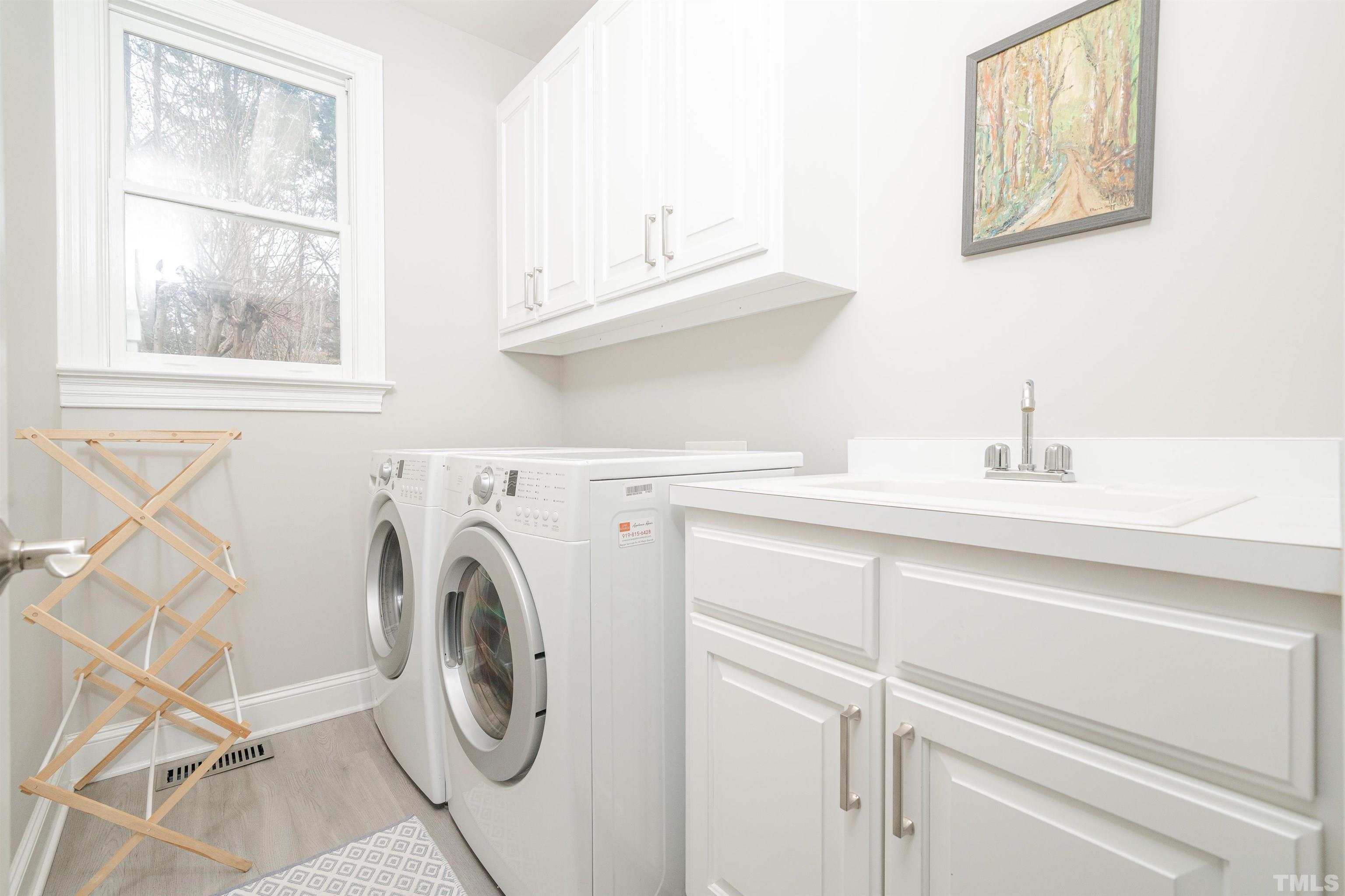 621 Bent Ridge Place Raleigh, NC 27615 - Photo 24 of 36 a utility room with dryer and washer