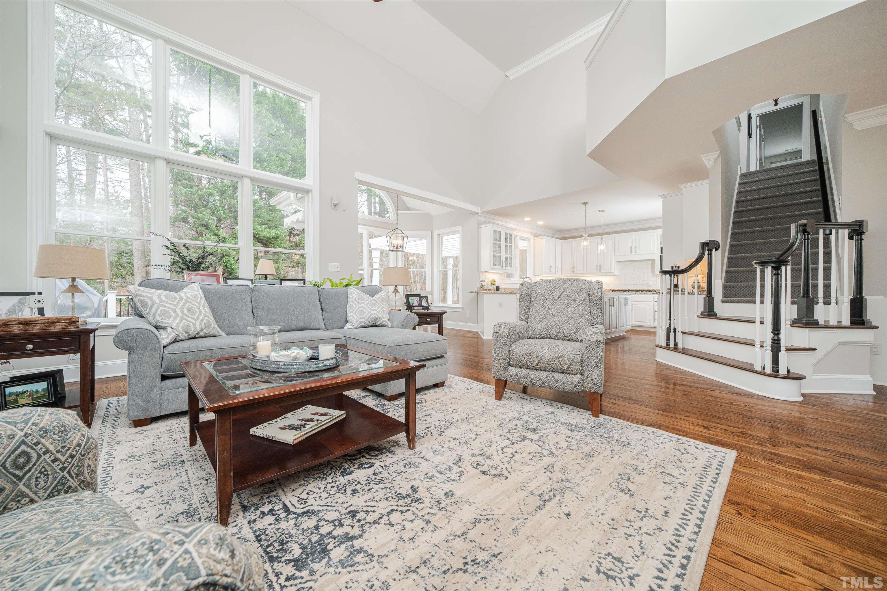 621 Bent Ridge Place Raleigh, NC 27615 - Photo 9 of 36 a living room with furniture large window and wooden floor