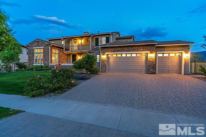 8564 Gypsy Hill Trail Reno, NV 89523 - Photo 1 of 25 a front view of a house with a yard and garage