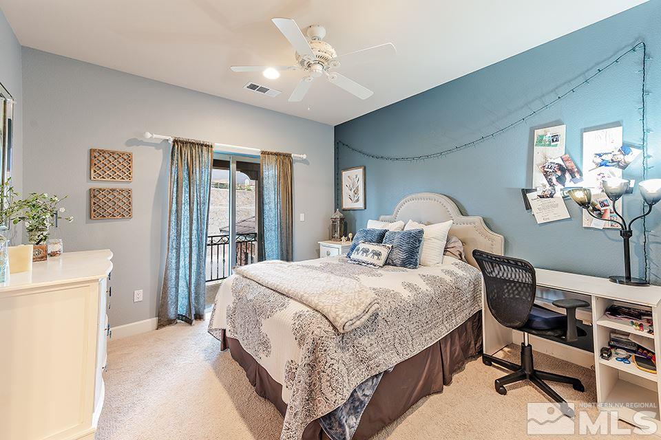 8564 Gypsy Hill Trail Reno, NV 89523 - Photo 12 of 25 a bedroom with a bed and a chandelier