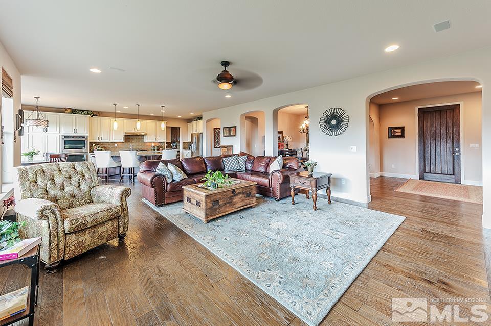 8564 Gypsy Hill Trail Reno, NV 89523 - Photo 17 of 25 a living room with furniture and a wooden floor