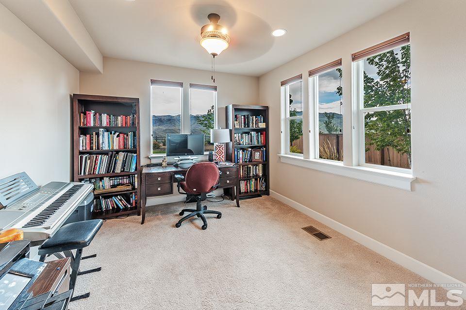8564 Gypsy Hill Trail Reno, NV 89523 - Photo 21 of 25 a view of a workspace with furniture and a window