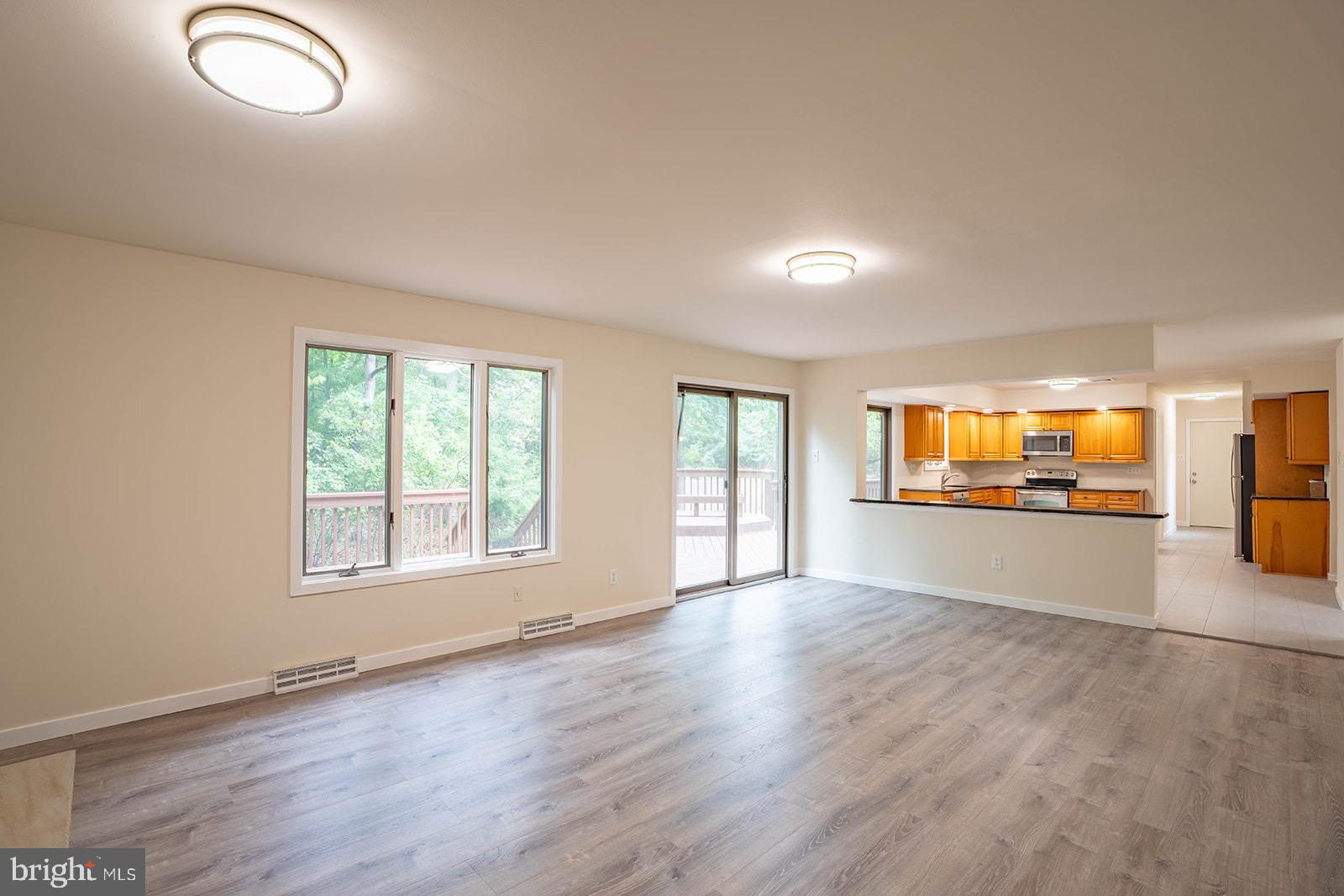 491 Kings Road Yardley, PA 19067 - Photo 23 of 52 an empty room with wooden floor and windows
