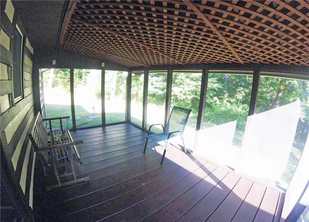 936 Blockhouse Run Road New Brighton, PA 15066 - Photo 14 of 25 The back screened-in porch offers a panoramic view of your private lot...
