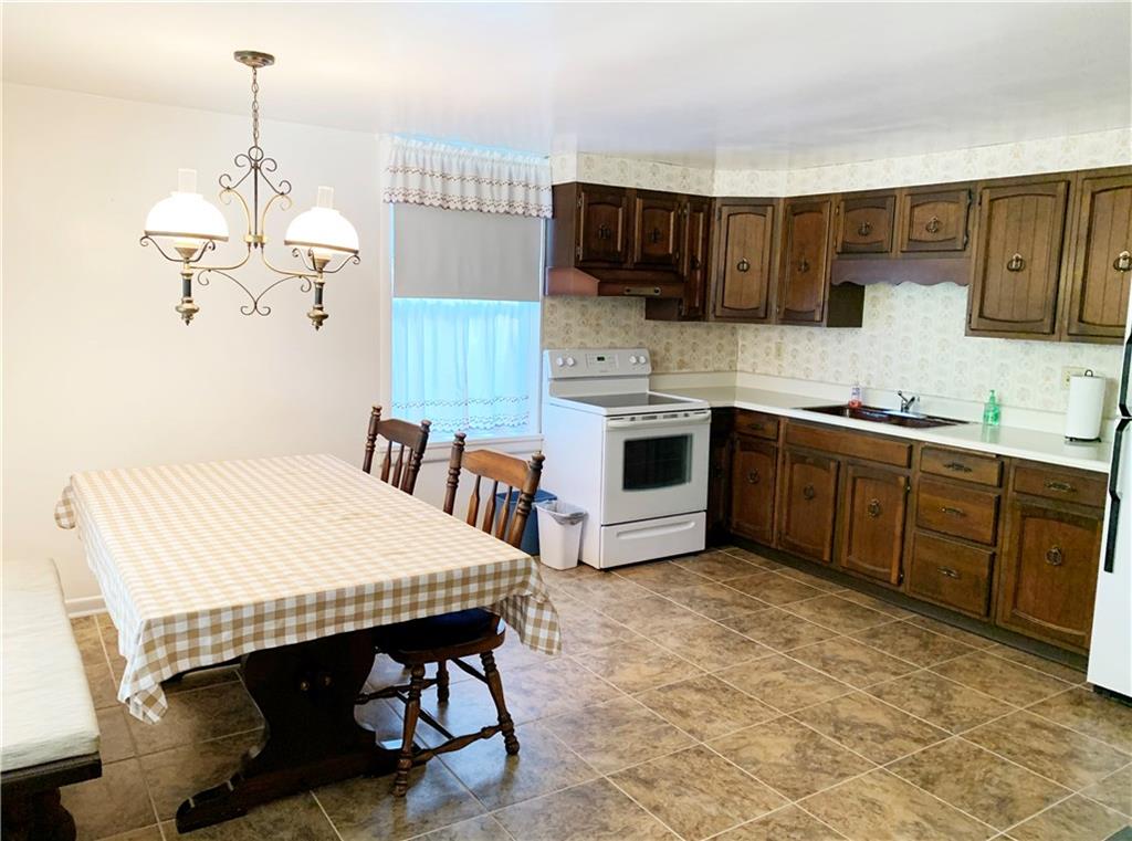 936 Blockhouse Run Road New Brighton, PA 15066 - Photo 5 of 25 There's no lack of space in the eat-in kitchen!