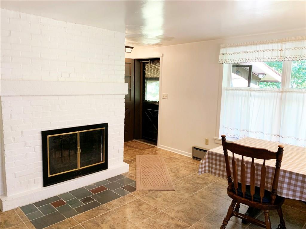 936 Blockhouse Run Road New Brighton, PA 15066 - Photo 7 of 25 Between the oversized picture window overlooking your private backyard & the woodburning fireplace - it's hard to tell which is the more attractive focal point...!