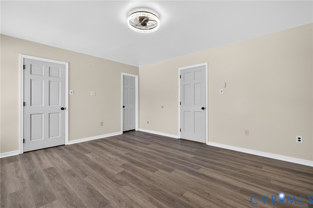 10050 Purcell Road Richmond, VA 23228 - Photo 16 of 26 an empty room with wooden floor