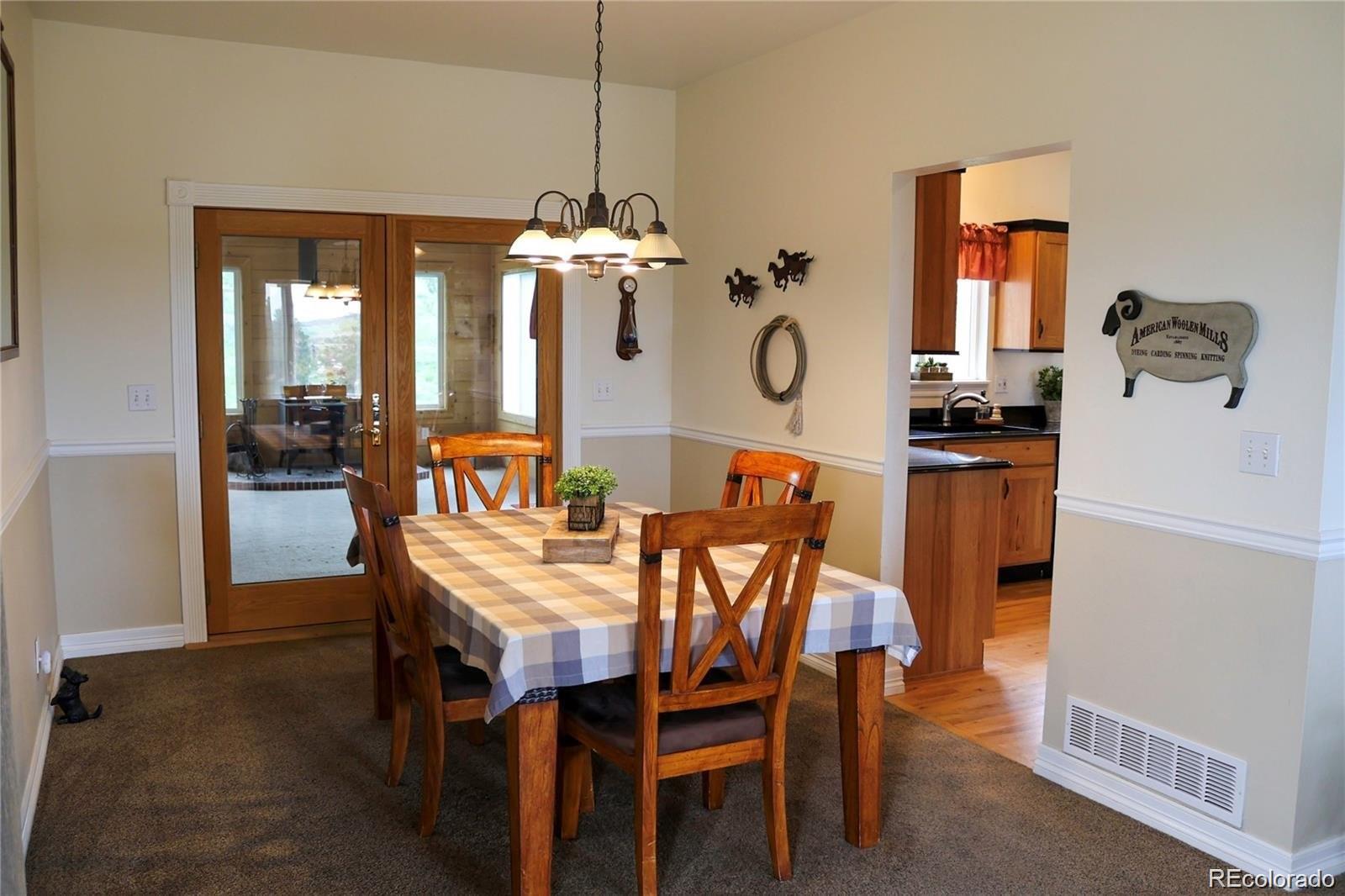 2501 Remington Road Elizabeth, CO 80107 - Photo 17 of 33 a view of a dining room with furniture window and outside view