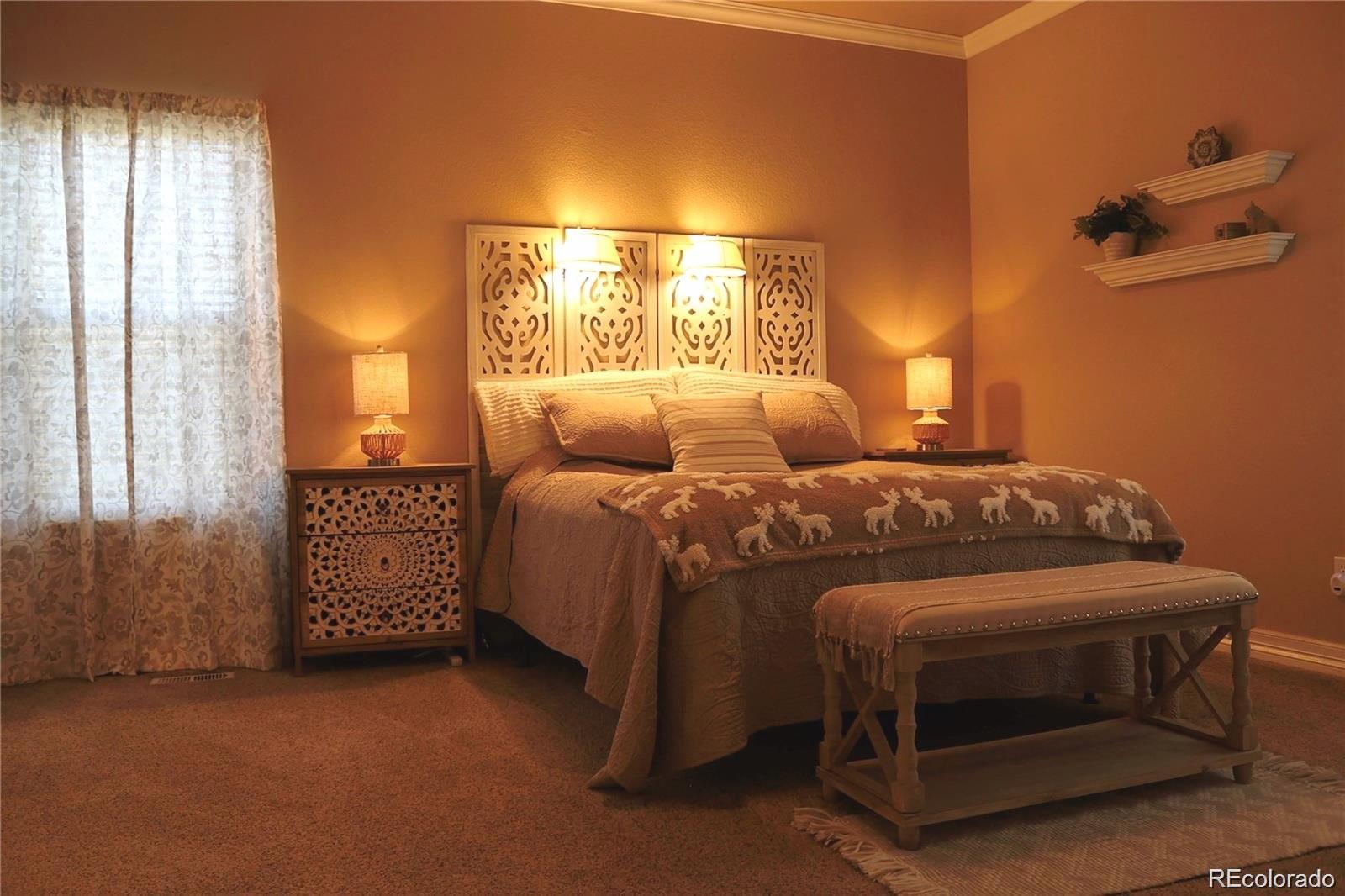 2501 Remington Road Elizabeth, CO 80107 - Photo 24 of 33 a bedroom with a bed and a cabinets