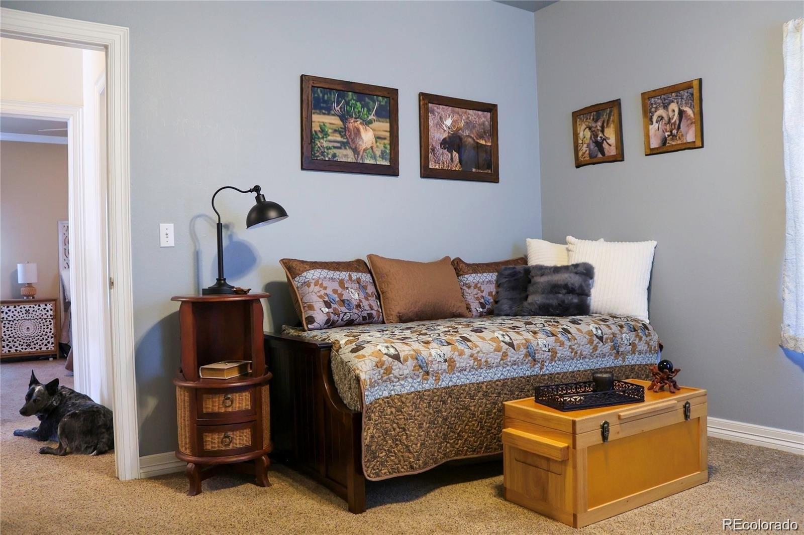 2501 Remington Road Elizabeth, CO 80107 - Photo 27 of 33 a bed room with a bed and a couch