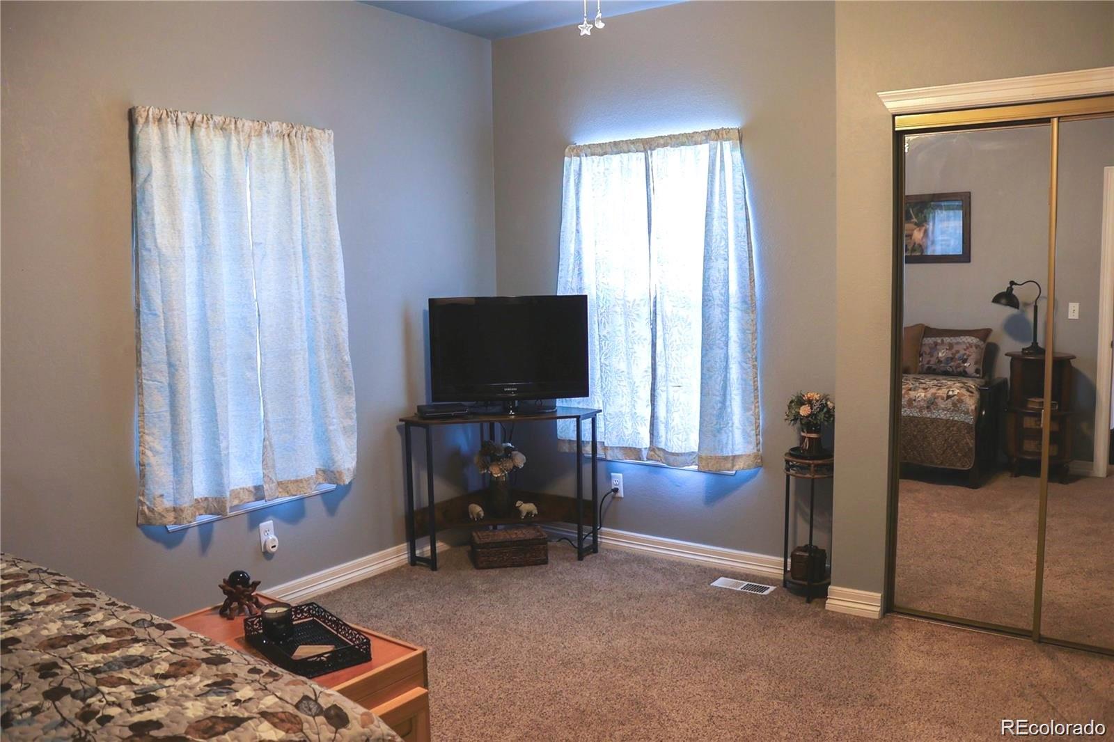 2501 Remington Road Elizabeth, CO 80107 - Photo 28 of 33 a room with window and a flat screen tv
