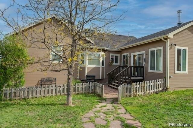2501 Remington Road Elizabeth, CO 80107 - Photo 4 of 33 a view of a chair and table in backyard of the house