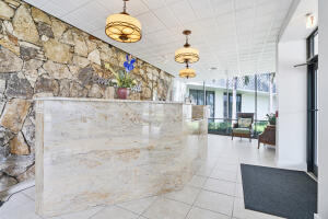 336 Golfview Road, Unit 303 North Palm Beach, FL 33408 - Photo 11 of 12 Font Desk/lobby