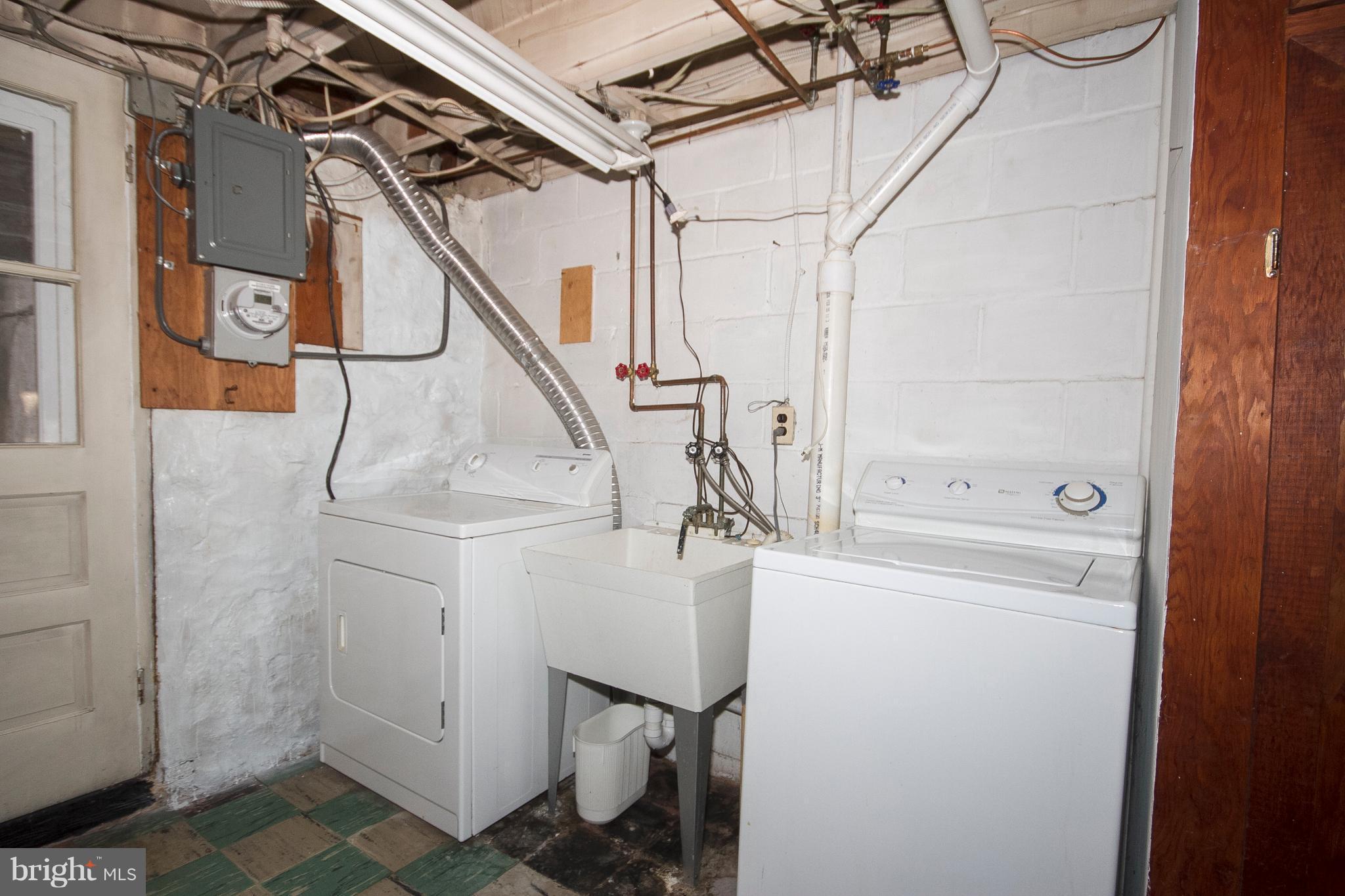 57 Burkshire Road Baltimore, MD 21286 - Photo 22 of 30 Utility area of the rear basement with W/D