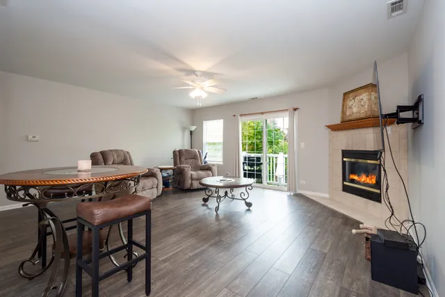 a livingroom with workspace window and a couch