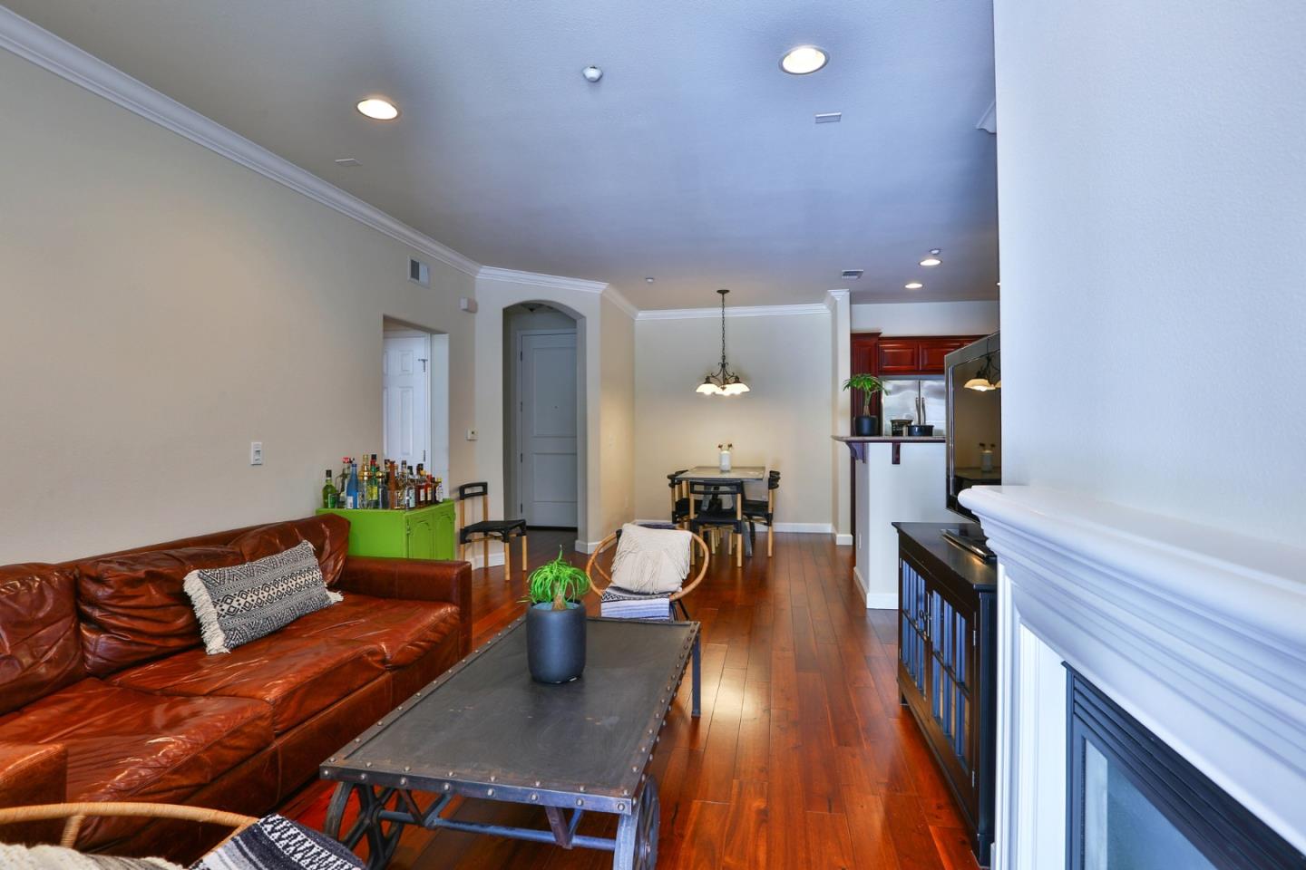 3465 Dublin Boulevard, Unit 111 Dublin, CA 94568 - Photo 7 of 21 a living room with furniture and a wooden floor