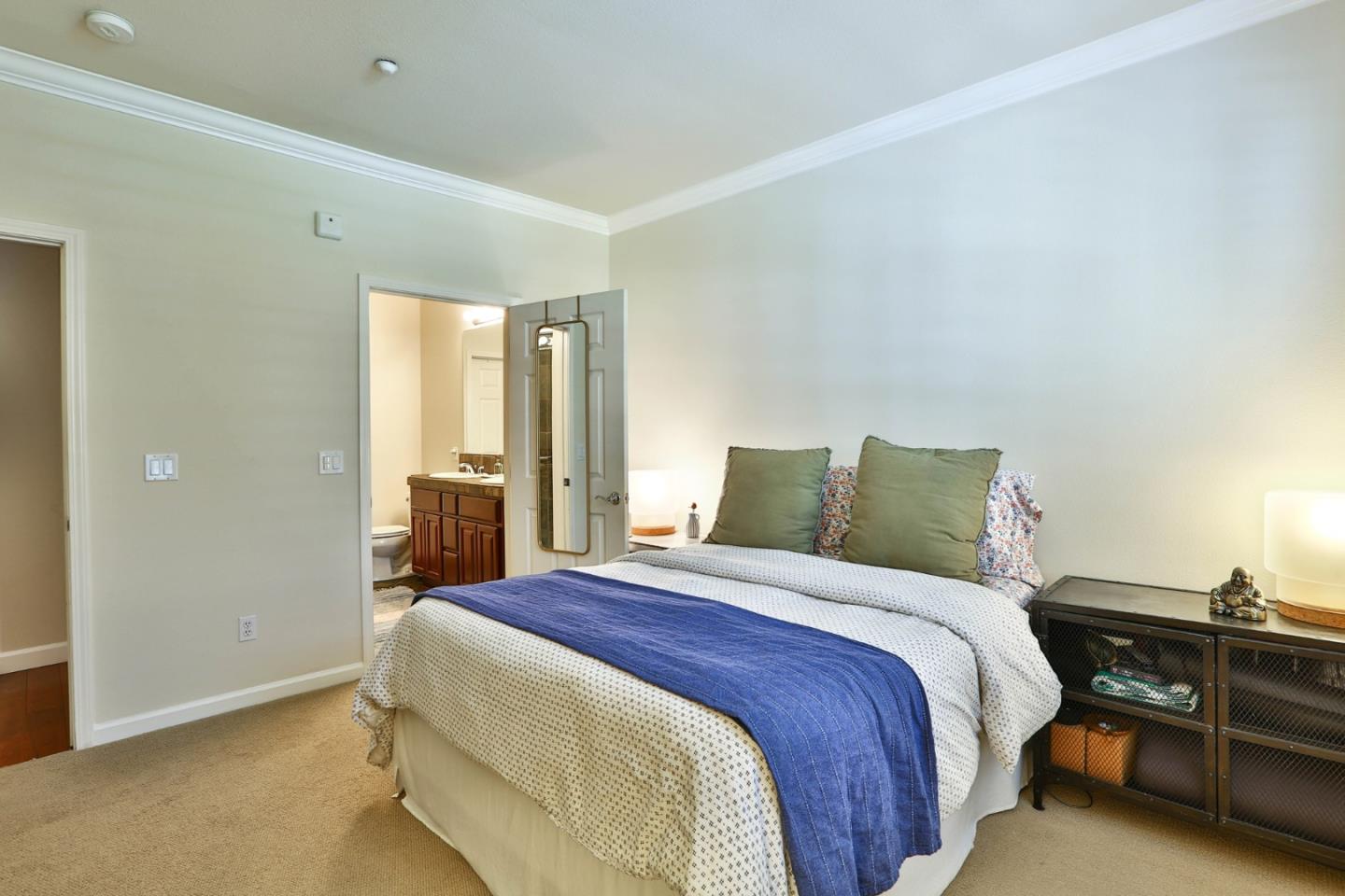 3465 Dublin Boulevard, Unit 111 Dublin, CA 94568 - Photo 8 of 21 a bedroom with a bed and cabinets