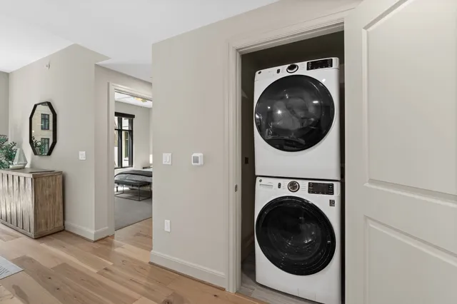a view of a hallway with washer and dryer