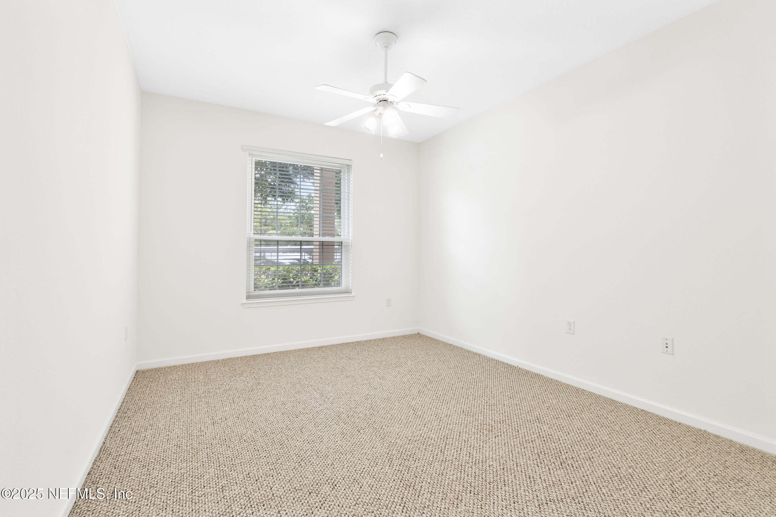 7990 Baymeadows Road East, Unit 120 Jacksonville, FL 32256 - Photo 15 of 38 an empty room with a window