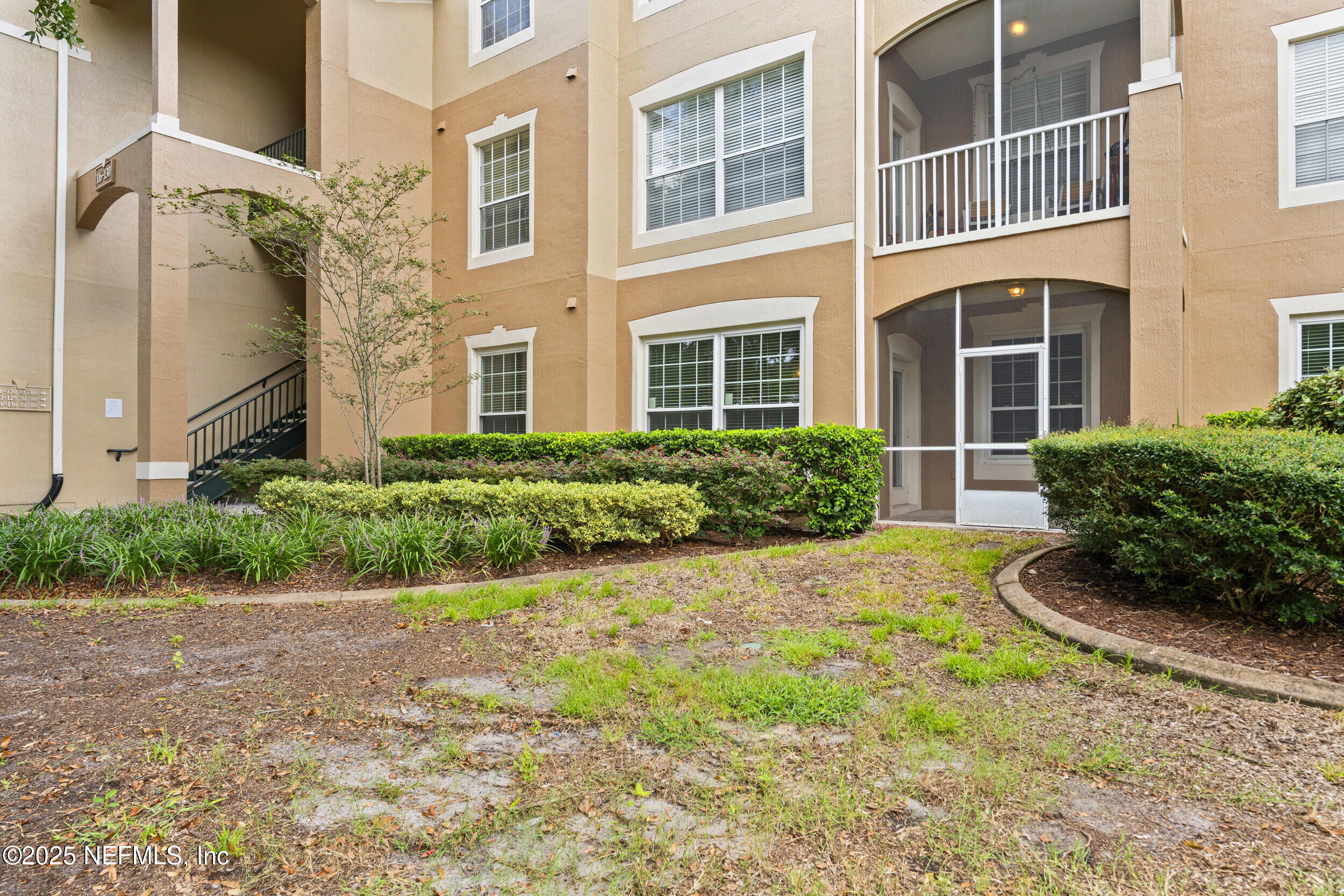 7990 Baymeadows Road East, Unit 120 Jacksonville, FL 32256 - Photo 2 of 38 a view of a garden with pathway