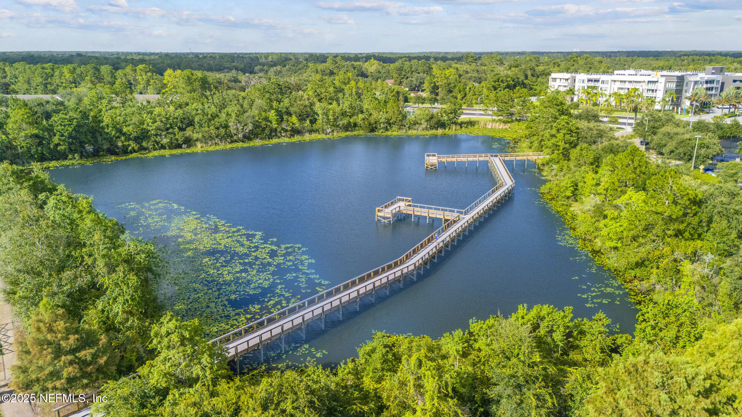 7990 Baymeadows Road East, Unit 120 Jacksonville, FL 32256 - Photo 36 of 38 a view of a lake from a yard