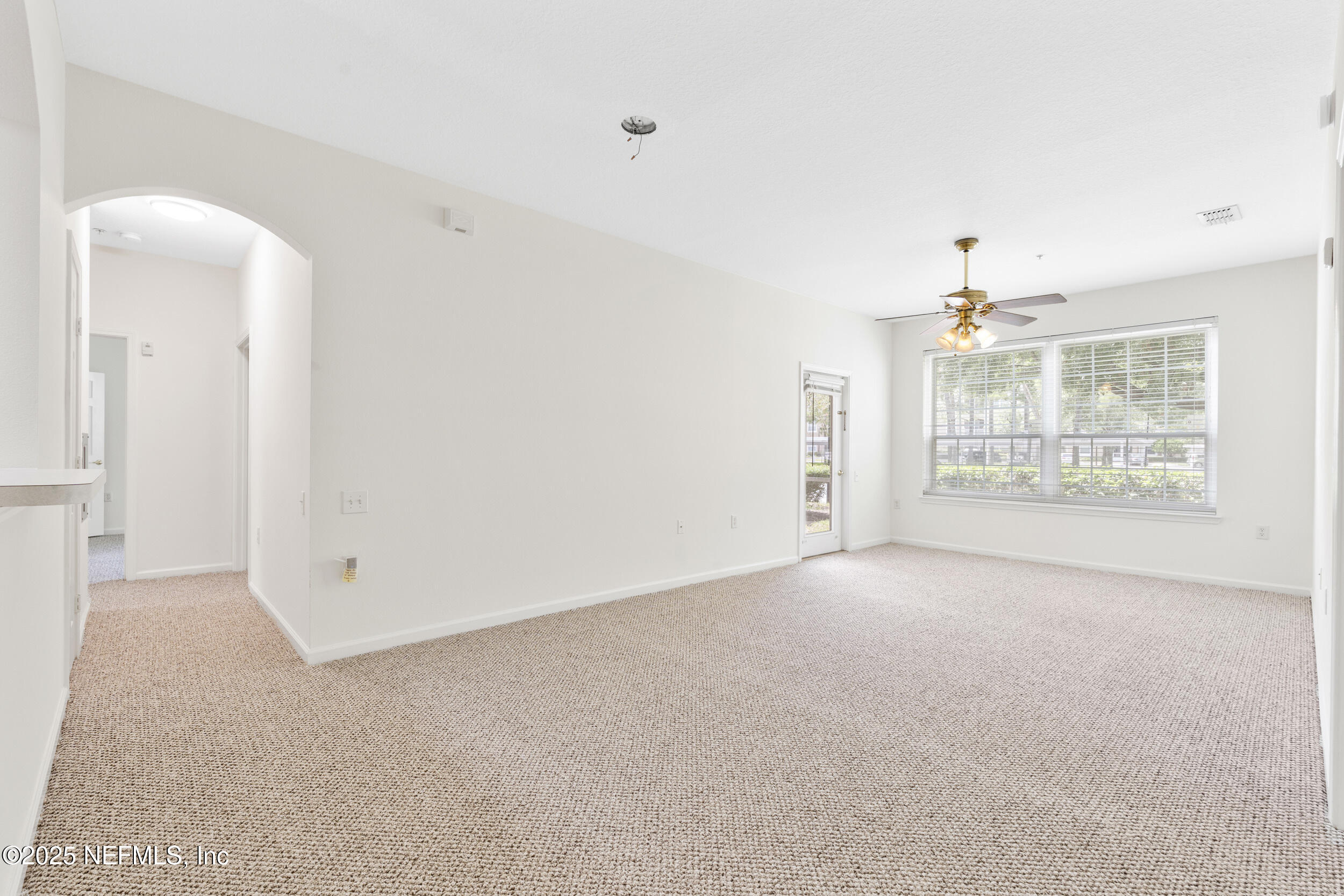 7990 Baymeadows Road East, Unit 120 Jacksonville, FL 32256 - Photo 8 of 38 a view of an empty room with a window