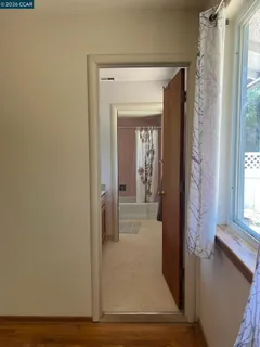 a bathroom with a sink vanity and mirror