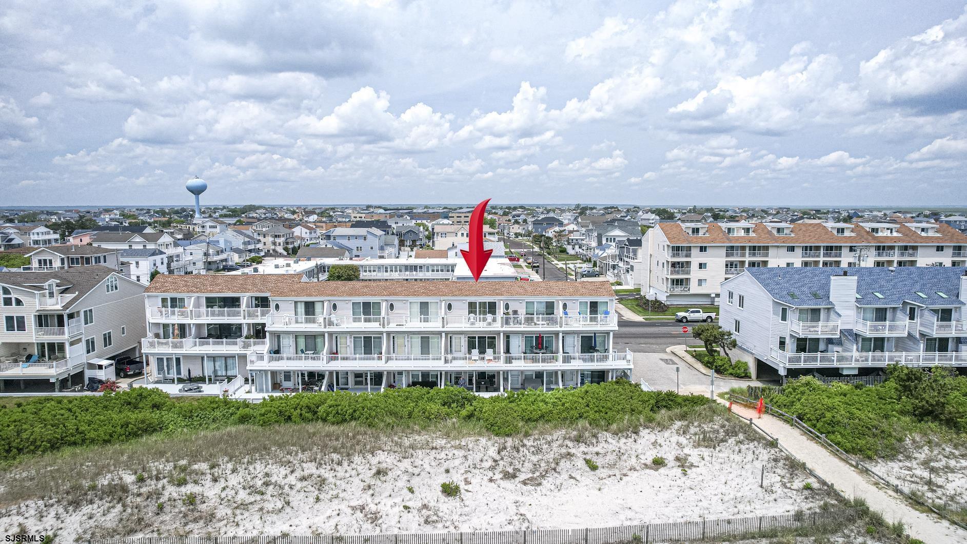 400 East Brigantine Avenue, Unit 2C Brigantine, NJ 08203 - Photo 1 of 37 a view of a city that has tall buildings and a big yard