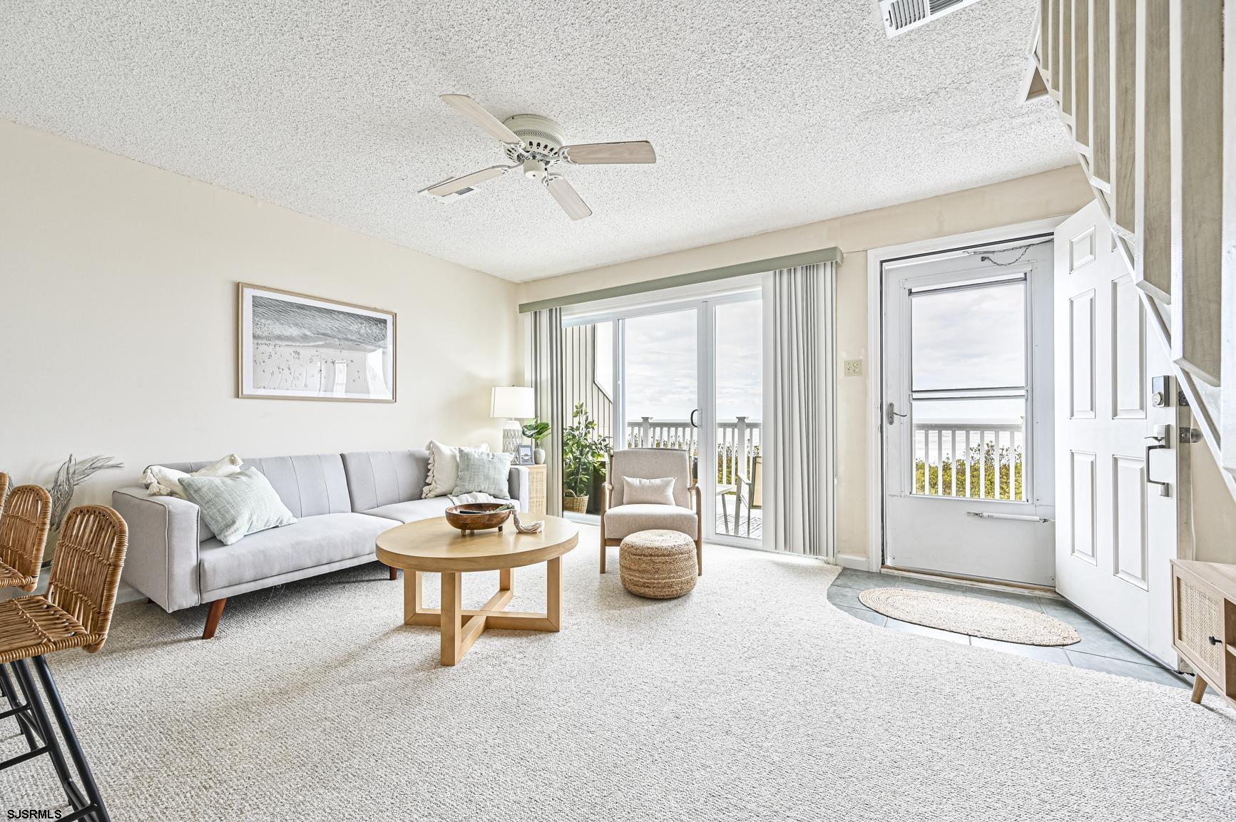 400 East Brigantine Avenue, Unit 2C Brigantine, NJ 08203 - Photo 2 of 37 a living room with furniture and a window