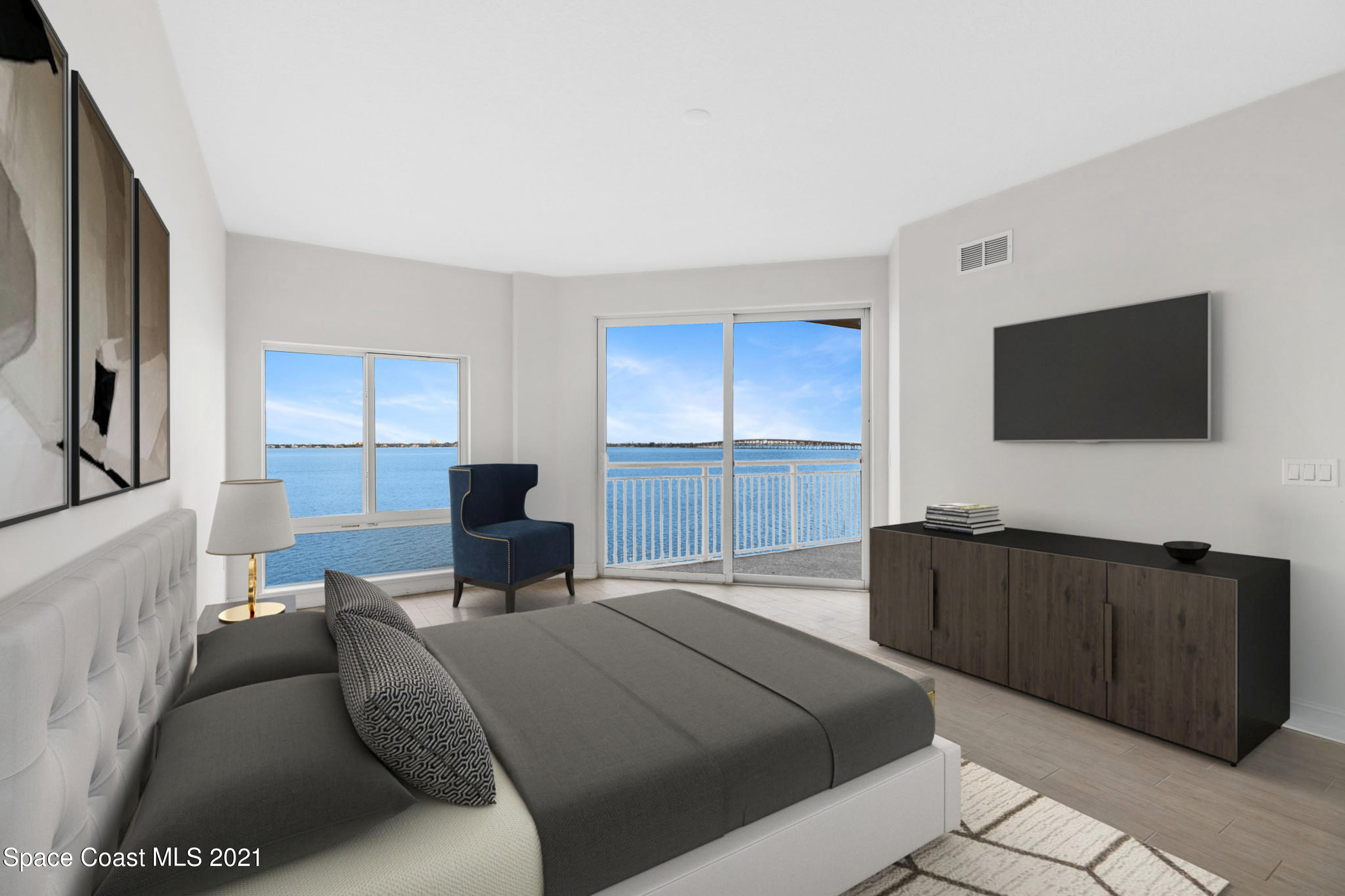 1465 South Harbor City Boulevard, Unit 404 Melbourne, FL 32901 - Photo 19 of 55 a bedroom with a bed and a flat screen television