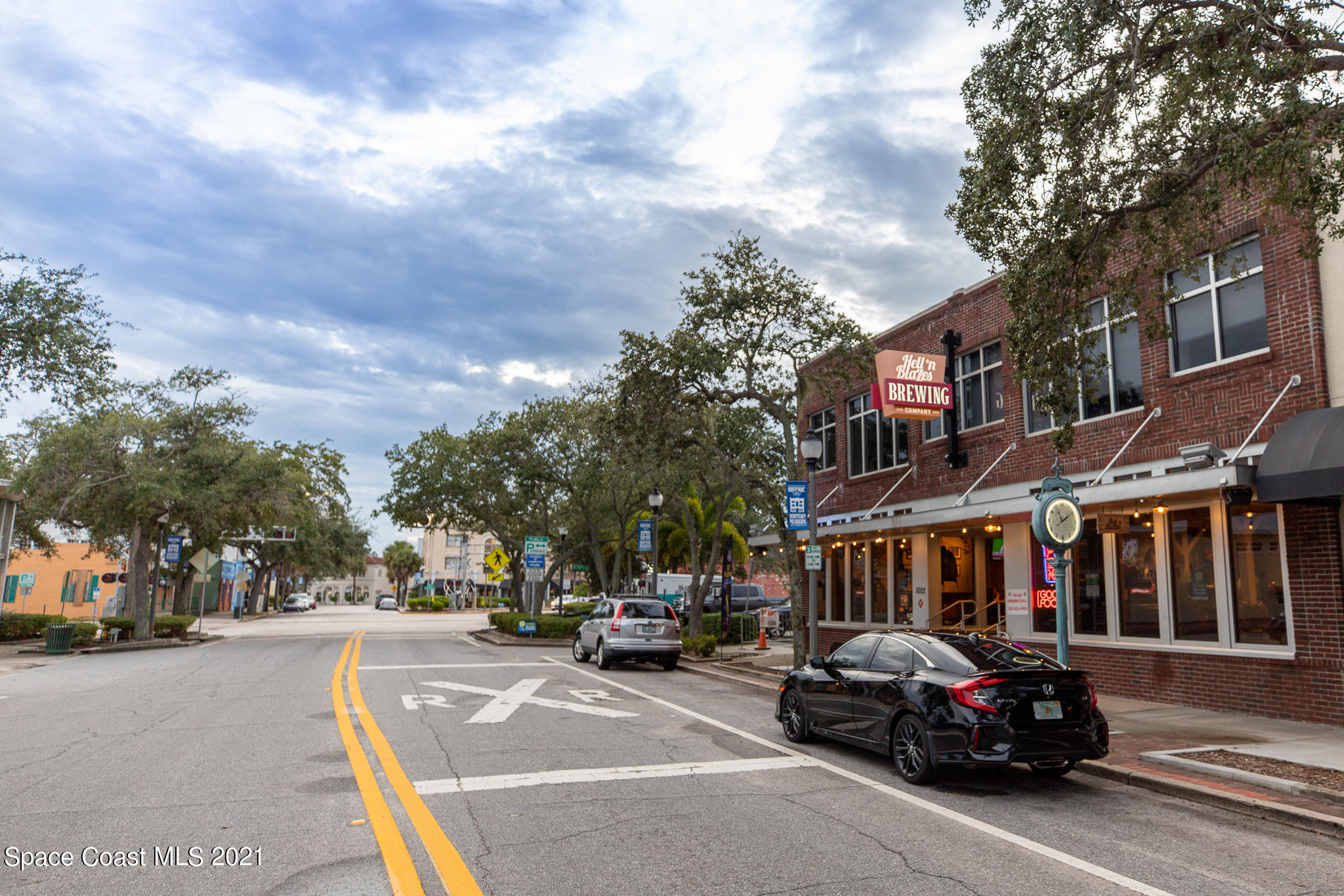1465 South Harbor City Boulevard, Unit 404 Melbourne, FL 32901 - Photo 26 of 55 a car parked on the side of a street