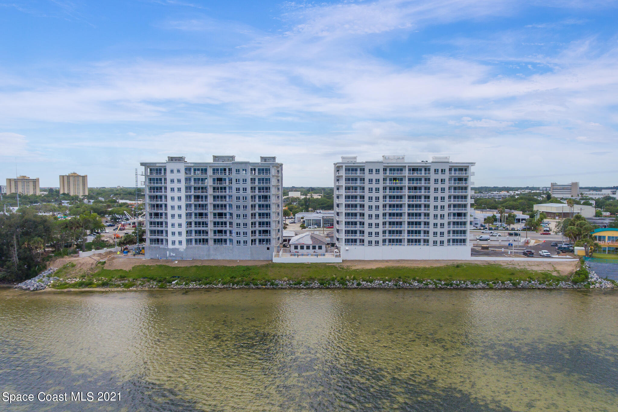 1465 South Harbor City Boulevard, Unit 404 Melbourne, FL 32901 - Photo 5 of 55 a view of a city with tall buildings and lake