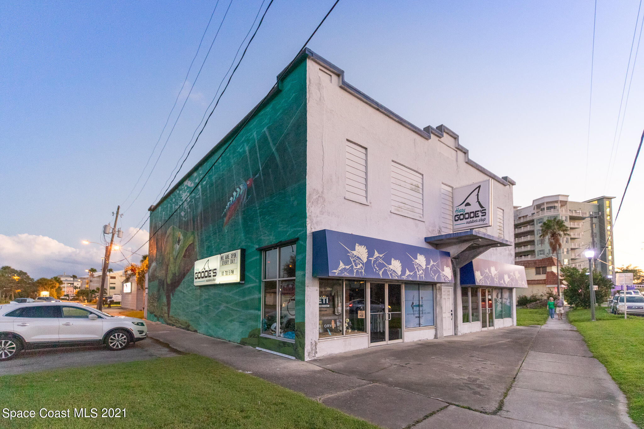1465 South Harbor City Boulevard, Unit 404 Melbourne, FL 32901 - Photo 45 of 55 a view of a street with a building and a street sign