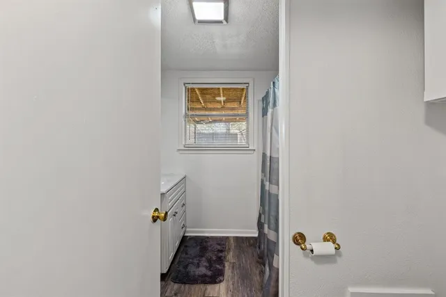 a view of an entryway with wooden floor