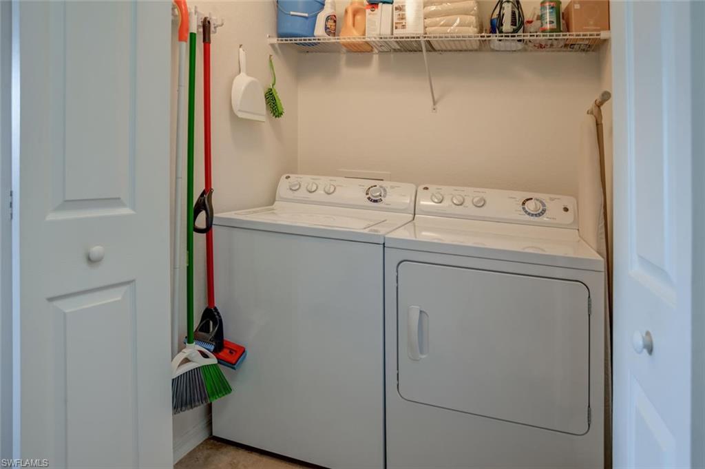 9731 Acqua Court, Unit 523 Naples, FL 34113 - Photo 17 of 27 a utility room with dryer and washer