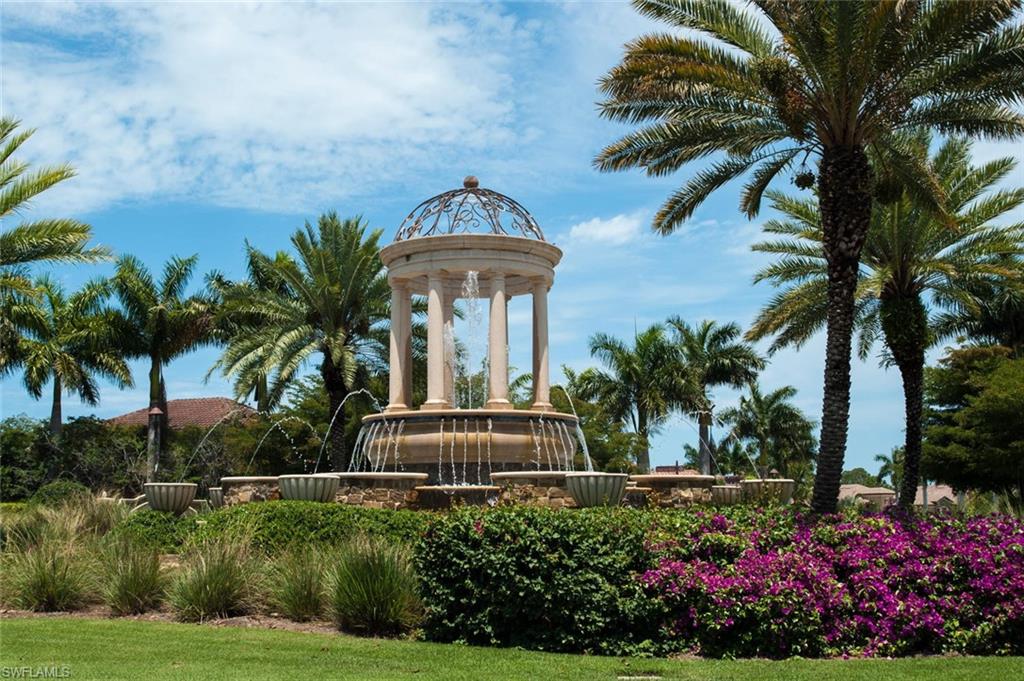 9731 Acqua Court, Unit 523 Naples, FL 34113 - Photo 26 of 27 a front view of a house with a garden