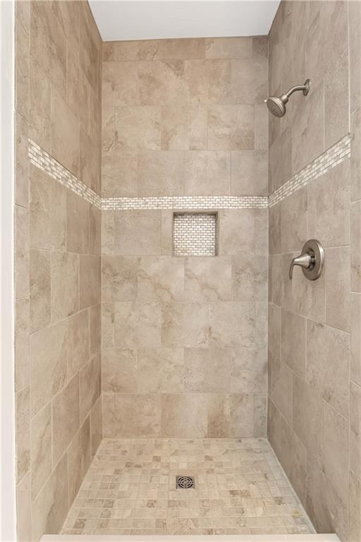 817 13th Street McKees Rocks, PA 15136 - Photo 10 of 18 Shower in first floor bathroom has stylish tile, fixtures and a built-in niche.