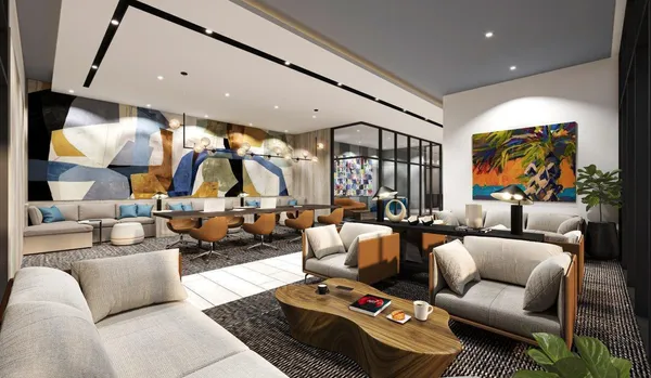 a living room with furniture and a chandelier